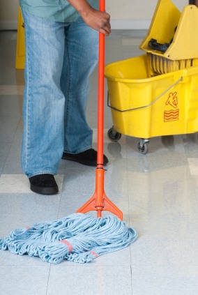 Clean and Honest Commercial Cleaning janitor in Harrisburg, PA mopping floor.